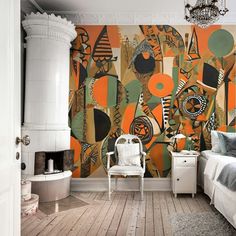 a bedroom with an orange and black mural on the wall next to a white chair