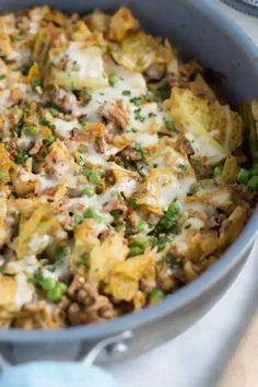 a casserole dish with meat, vegetables and cheese