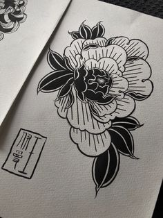 some black and white flowers are on paper