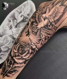 a black and white photo of a bird with roses on it's arm, done by julia lounderro art