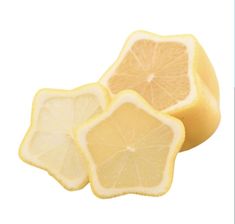 lemon slices cut in half on a white background