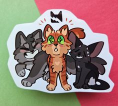 a sticker with three cats on it sitting next to each other in front of a green and pink background