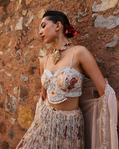 Dive into elegance with this ensemble: an embellished printed choli paired harmoniously with an embellished cape and a printed circular skirt. This ensemble captures attention with its intricate detailing and vibrant prints, offering a perfect blend of tradition and contemporary style. Ideal for weddings, festive celebrations, or cultural events, it promises to make a striking statement. Elegant Georgette Lehenga With Printed Motifs, Elegant Lehenga In Georgette With Printed Motifs, Elegant Lehenga With Printed Motifs In Georgette, Party Lehenga In Georgette With Printed Motifs, Party Lehenga With Printed Motifs In Georgette, Georgette Lehenga With Printed Motifs For Party, Reception Lehenga With Printed Motifs In Georgette, Bohemian Georgette Lehenga With Printed Motifs, Bohemian Embellished Georgette Lehenga