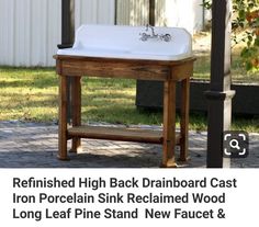 an old fashioned sink is on display in the yard