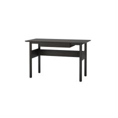 a black table sitting on top of a white wall