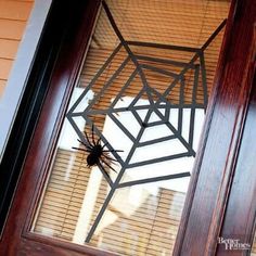 a spider web hanging from the side of a door