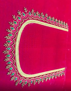 a pink and gold cloth with an embroidered border on it's edge, in the shape of a rectangle