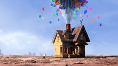 a house with many balloons flying over it