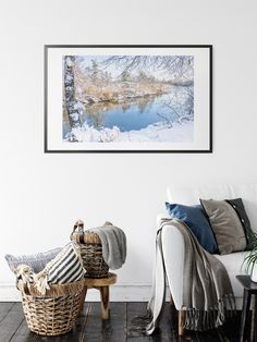 a living room filled with furniture and a painting on the wall