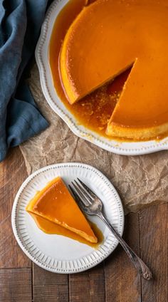 a slice of pumpkin cheesecake on a plate with a knife and fork next to it