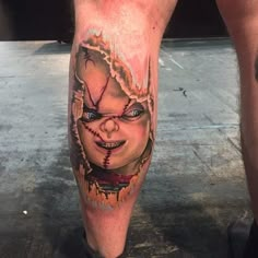 a man's leg with a scary face on it