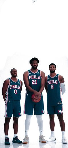 three basketball players pose for a photo in front of a white background with the philadelphia 76 logo on it