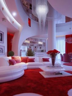 a living room filled with lots of white furniture and red carpeted floor coverings