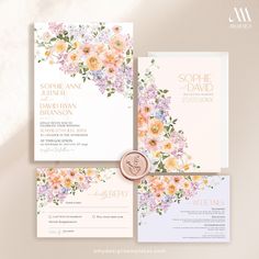 wedding stationery with flowers on it and a wax seal in the middle is shown