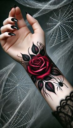 a woman's arm with a rose tattoo on it and spider webs in the background