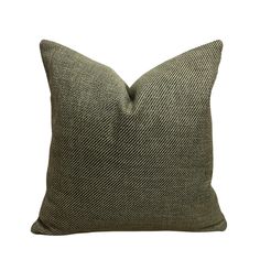 a green pillow on a white background