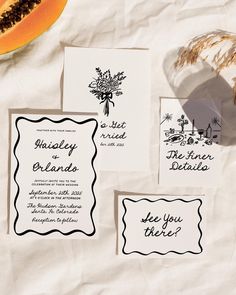 the wedding stationery is laid out on paper