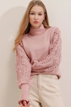 Chunky half turtleneck sweater featuring embroidered sleeves and ruffled wrists. Half Turtleneck Lace sleeves 100% Acrylic Pull Rose, Curve Model, Feminine Romantic, Cable Knit Turtleneck Sweater, Camel Sweaters, Fringe Sweater, Classic Sweater, The Fringe, Roll Neck Sweater