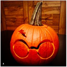 a pumpkin with glasses carved into it