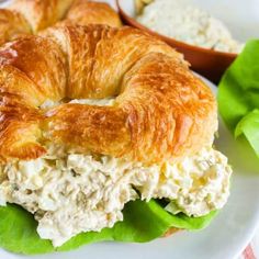 a croissant sandwich with chicken salad on it