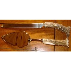 a wooden door with a metal handle on it and a piece of wood that has been cut in half