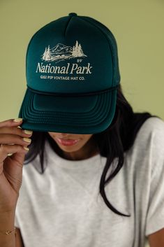 Designed for adventure, the National Park Trucker Hat has got a comfy adjustable snap-back strap and cool mesh for breezy wear. Choose from earthy shades and sport a retro national park graphic. Perfect for exploring the outdoors!! 100% polyester adjustable strap curved brim medium crown height medium stiffness Vintage 5-panel Travel Hat, Retro Baseball Cap For Outdoor, Casual Trucker Hat For Adventure, Retro Outdoor Baseball Cap, Vintage 5-panel Hat For Outdoor Activities, Vintage Cap For Outdoor Activities, Vintage Green Snapback Hat For Outdoor, Vintage Snapback Baseball Cap For Outdoor Activities, Vintage Baseball Cap With Curved Bill For Outdoor