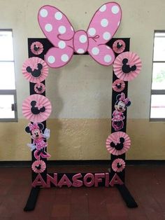 a minnie mouse photo frame with pink and white polka dots on it, decorated with the name anasofa