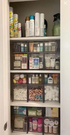 an organized pantry with clear bins filled with food