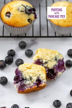 blueberry muffins with pancake mix on a cooling rack and fresh blueberries