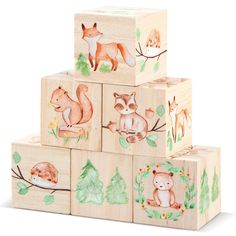 four wooden blocks with animals painted on the front and back, stacked up to each other