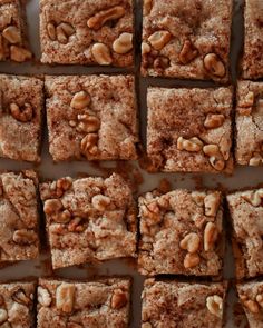 several squares of brownies with nuts on top