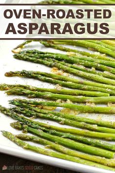 asparagus on a white plate with the title overlay reads oven roasted asparagus