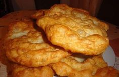 some fried food is stacked on top of each other in the middle of a plate