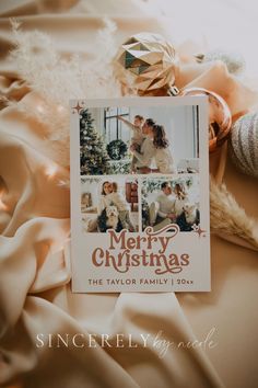 a christmas card sitting on top of a blanket