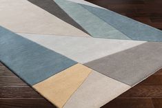 an area rug with different colors and shapes