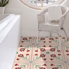 a white chair sitting in front of a round window