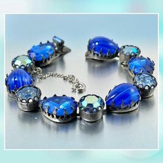 Signed REGENCY Blue AB Rhinestone and Lapis Lazuli Art Glass Stone Vintage Bracelet #rhinestones #regency #glass Blue Crystal Bracelet With Sparkling Stones, Adjustable Blue Bracelets With Sparkling Stones, Blue Crystal Bracelet With Rhinestones, Adjustable Blue Crystal Rhinestone Bracelet, Adjustable Blue Crystal Bracelet With Rhinestones, Blue Jeweled Metal Jewelry, Blue Crystal Bracelet With Rhinestones For Party, Blue Adjustable Jewelry With Sparkling Stones, Blue Rhinestone Crystal Bracelet For Party