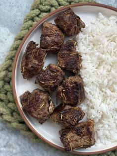 meatballs and white rice on a plate