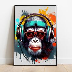 a monkey wearing headphones and sunglasses with colorful paint splatters on the wall