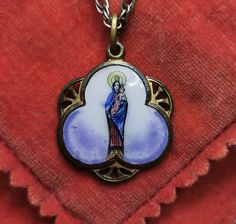 A beautiful vintage Blessed Virgin Mary medal, Spanish Madonna and Child medal on a chain, very nicely done, in fair vintage condition, ideal for necklace, would make a nice gift for someone special! Comes with an approx. 24-inch long 925 silver necklace (see photo 4)! Material: brass, enamel Medal measures: approx. 23 mm (0.9 inch)  A stunning religious jewelry shop well worth a visit ... https://www.etsy.com/shop/100saints. PLEASE LOOK AT THE PICTURES, THEY ARE PART OF THE DESCRIPTION AND ARE Vintage Miraculous Medal Necklace As Gift, Vintage Miraculous Medal Necklace Gift, Antique Miraculous Medal Necklace As Gift, Vintage Miraculous Medal Pendant Jewelry, Vintage Memorial Necklaces, Vintage Miraculous Medal Medallion Jewelry, Vintage Necklaces With Miraculous Medal, Vintage Round Miraculous Medal Necklace, Vintage Round Necklace With Miraculous Medal