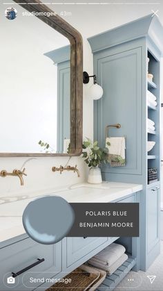 a bathroom with blue cabinets and white counter tops, along with the words polaris blue on