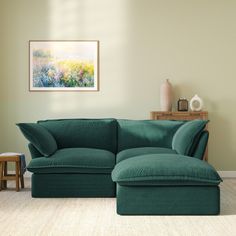 a living room with a large green couch