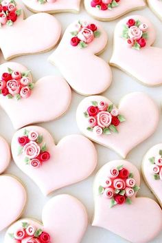 some heart shaped cookies with roses and hearts on them are being viewed on instagram