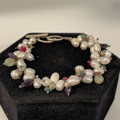 Nwot- Handmade Bracelet With Freshwater Pearls, Rubies, Aquamarine, Apatite, Amethyst, Kyanite And Tourmaline, With A Sterling Silver Toggle Clasp. 7.5 Inches Long. All Natural Stones, New Bracelet White Pearl Bracelet With Oyster Design In Sterling Silver, Elegant White Beaded Bracelets With Gemstones, White Pearl Bracelet With Natural Stones For Wedding, Elegant White Beaded Gemstone Bracelets, Elegant White Gemstone Beaded Bracelets, White Sterling Silver Oyster Bracelet Jewelry, White Sterling Silver Jewelry With Oyster Bracelet, Handmade White Beaded Sterling Silver Bracelets, White Sterling Silver Beaded Bracelets