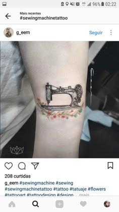 a tattoo with a sewing machine on it