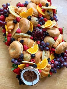 an arrangement of breads, fruit and chocolate