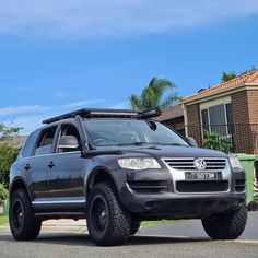 an suv parked in front of a house