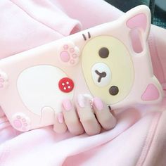 a pink phone case with a bear on it