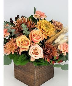 a wooden box filled with lots of flowers