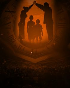 the silhouettes of three people are standing in front of a large clock